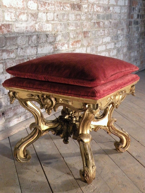 Very decorative Roman gilt stool of exuberant baroque form.