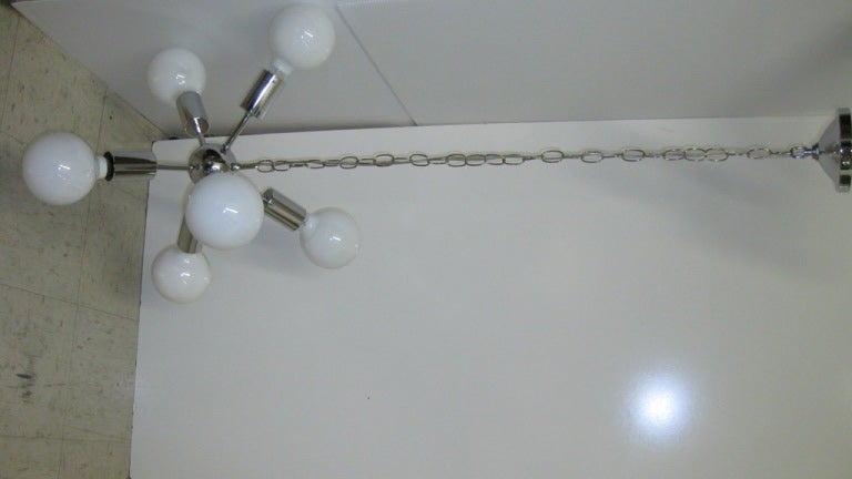 Beautiful Mid-Century early Sputnik chandelier in nickel, after Stilnovo, Please also visit sjulian.1stdibs. to see more of our collection.
