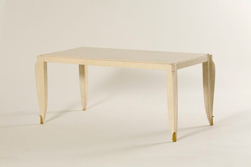 PASC 08<br />
Fine Covered Rectangular Coffee Table by Jean Pascaud (1903-1996)<br />
Original parchment with gilt-bronze sabots. <br />
<br />
See Le Mobilier Francais by Y. Brunhammer p. 111, Massin Ed.<br />
for a Cabinet with similar