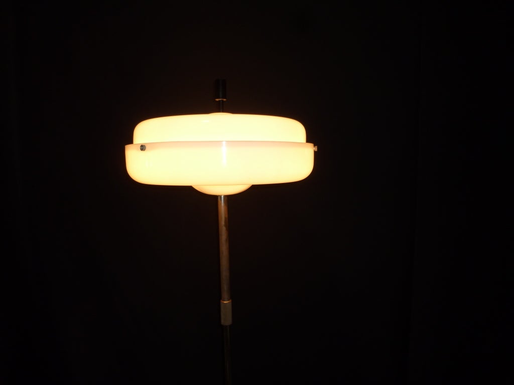 Italian floor lamp with  white  acrylic  shade, adjustable height.