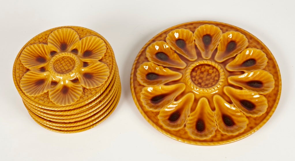 A very beautiful Oyster service by the French potier, Marius Giuge of Vallauris, France. The set contains one Oyster serving platter and six Oyster plates. The serving platter measures 14 1/2