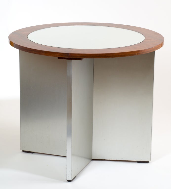 Rare modernist side table by Jansen, the polished wood framed mirrored top raised on aluminum sheathed wood base with tapering legs.
Signed, with serial numbers.
Only one available
Dimensions: 35 Diameter X 29 H.