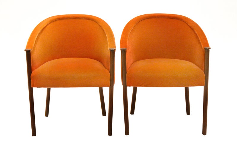 Pair of Ward Bennett chairs with burnt orange mohair and solid walnut sculptural legs. These chairs were produced by Ward Bennett for Brickel Associates Inc. One chair has original tag. Chairs retain all original finish and fabric. Slight blemishes