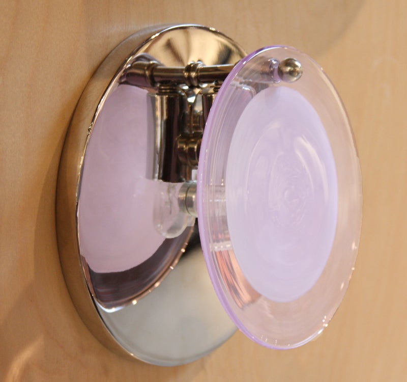 A pair of Vistosi Murano nickel backed wall sconces with clear and pale pink glass disc shades. Price is for a single sconce.

Many pieces are stored in our warehouse, so please click on CONTACT DEALER under our logo below to find out if the
