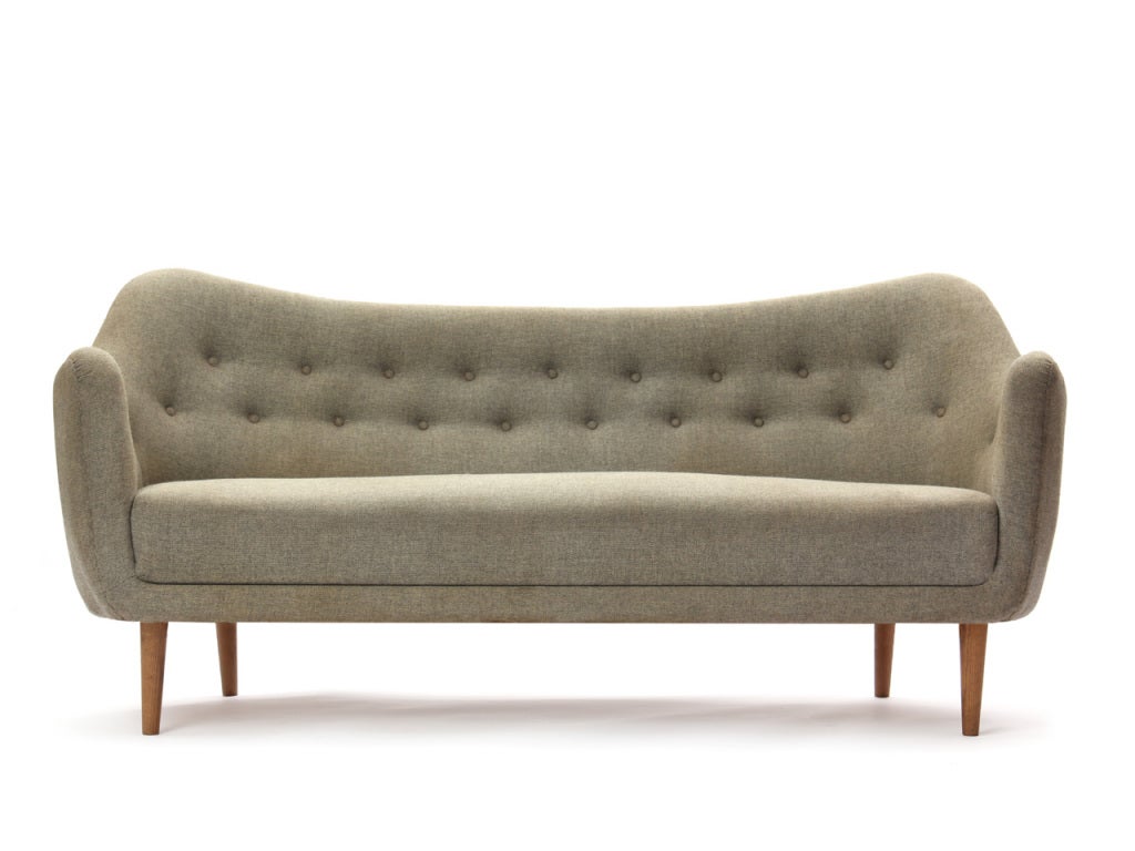 A three-seater 'Poet' sofa with the original light grey wool hopsack upholstery, on tapered oak legs.