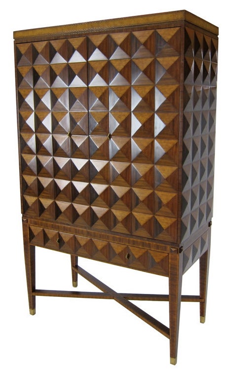 Amazing Bar or Media Cabinet covered in 3 dimensional pyramids of Rosewood, Satinwood, and Bleached Mahogany, raised on a console base with cross-stretchered and tapering legs terminating in brass sabots.  Base has a single, matching drawer. 