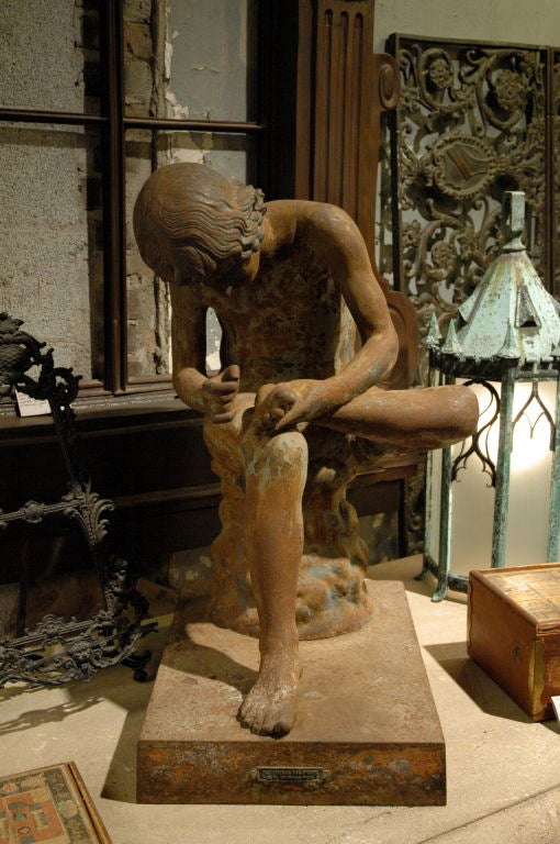 CAST IRON SPINARIO FIGURE<br />
19th century Boy with Thorn, also called Fedele (Fedelino) or Spinario, is based on a Greco-Roman Hellenistic sculpture of a boy withdrawing a thorn from the sole of his foot, now in the Palazzo dei Conservatori,