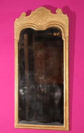 Fine George I Carved Gesso and Giltwood Mirror, having a shaped top with trefoil centering by scrolling leaves, with shaped moulded frame and a replaced beveled mirror plate. English, circa 1720