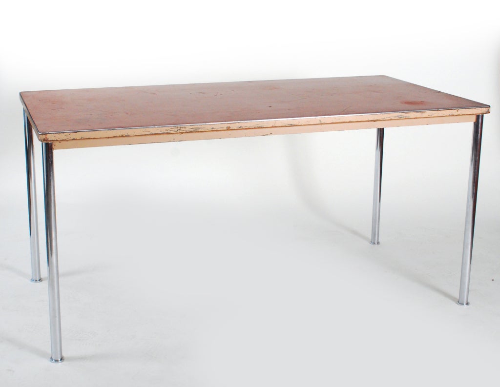 Rare and early table/desk (Model 1852) by Le Corbusier for Embru. Wonderful early modernist design by one of the most influential architects of the 20th century with chrome plated steel legs, an enamel painted edge, and a red linoleum work surface.