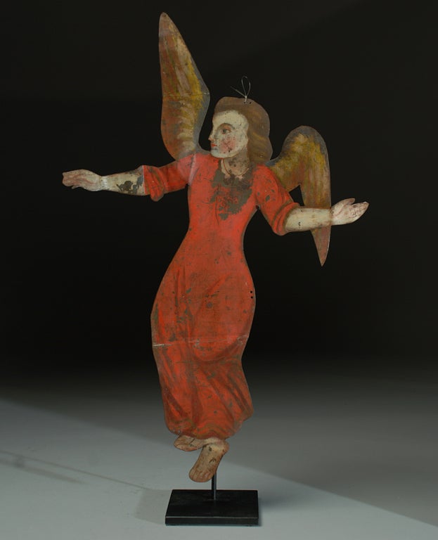 A charming 19th century hand painted tin cut out retablo angel from Mexico. Displayed on a high quality custom made stand.

Dimensions: approximately 25 inches high with display stand.

**********************************************

About Us: