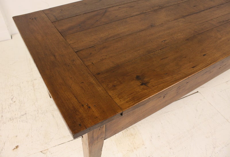 A very rich and good-looking antique coffee table with two large drawers, one on each end, from France. The medium dark cherry is a good color with nice graining. Breadboard ends.