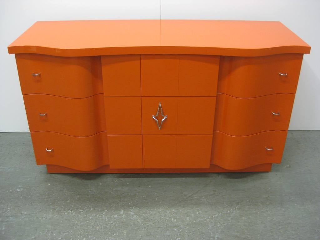 Serpentine Art Deco Orange Dresser, with Asymmetrical drawers, Modernist and cubist Elements are incorporated into the design of this piece. 
H31.5d20.5W56.25 Drawers W21.5 W28.5
 D7 bottom 6.5.