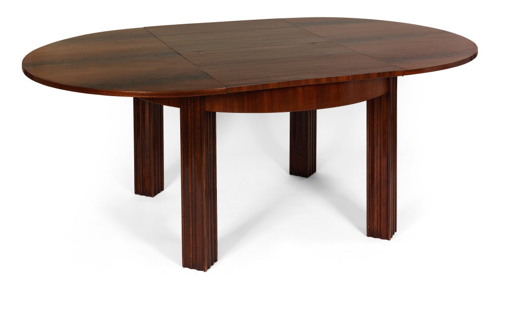 Vienna, c. 1927
Designed by Otto Prutscher
Made by Ludwig Schmidt

Beautiful circular extendible dining table in mahogany veneer.  Extra leaf conveniently stored inside the table. Easily extended with built-in rotating mechanism.

Height: