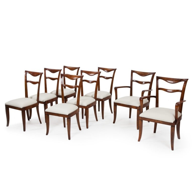 Set of six elegant figured walnut dining chairs and two carvers reupholstered in leather, by Maurizio Tempestini.
Dimensions of carvers: Height:37.01in, Height2:18.31in, Length 25.25in, Depth 20in
Maurizio Tempestini (1908-1960),born in Florence,