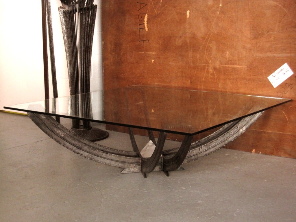 A cocktail table in hand-hammered wrought iron with a pyramid shaped rock crystal at its centre. A high achievement in iron work signed Subervie.