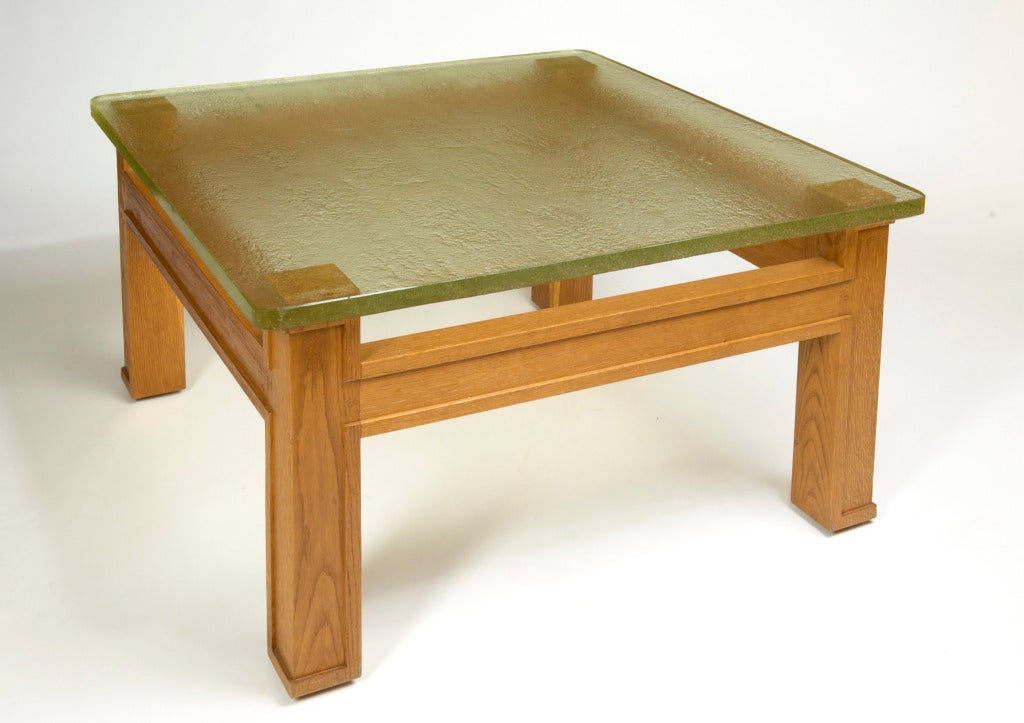 Jacques Adnet (1900-1984), attributed to,
Superb large carved oak modernist table with beautiful sand-cast glass top.
France, circa 1950.
Dimensions: 37 x 37 x 20 H.