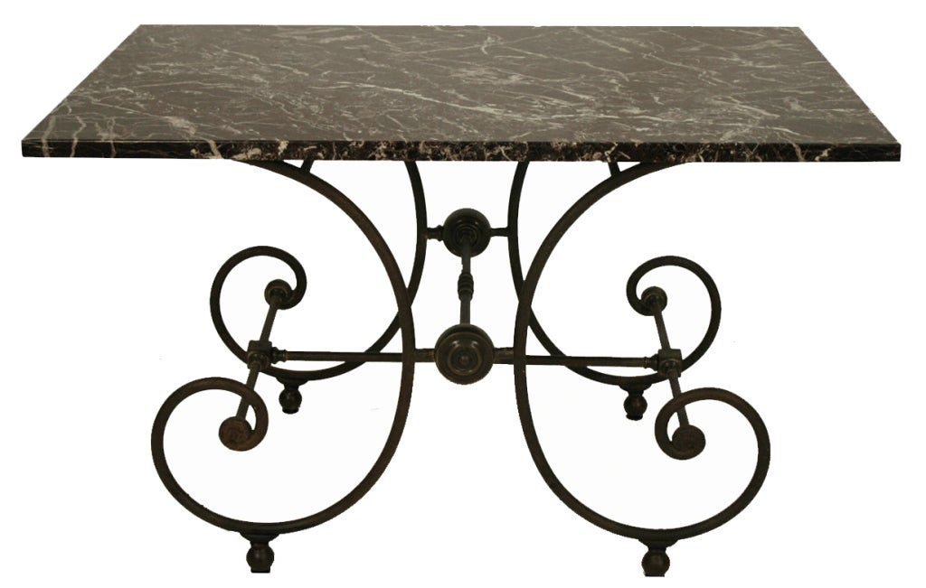 French pastery table with rectangular marble top over scrolled iron and brass base with original marble.