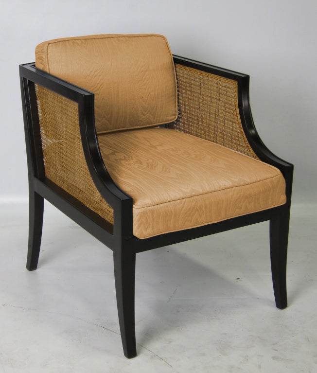 Elegant Lounge Chair with caned panels and saber legs by Lorin Jackson for Grosfeld House c. 1941.  Refinished in dark Brown Lacquer.