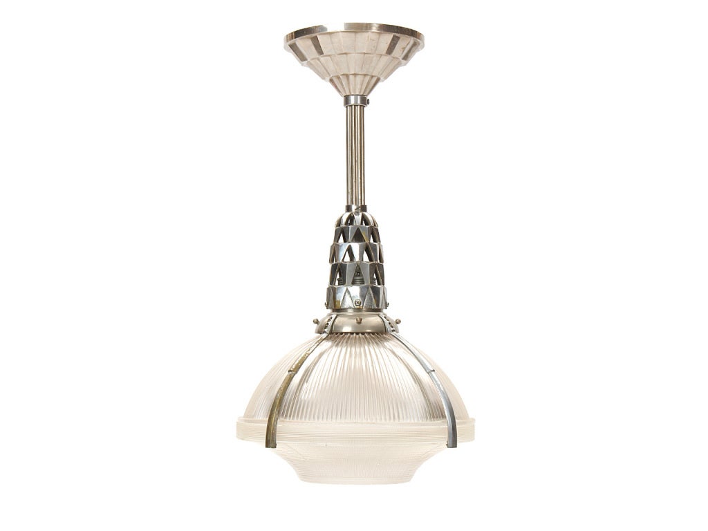 A nickel ceiling fixture with a holophane shade. Acquired from a building designed by Jacques-Emille Ruhlmann.