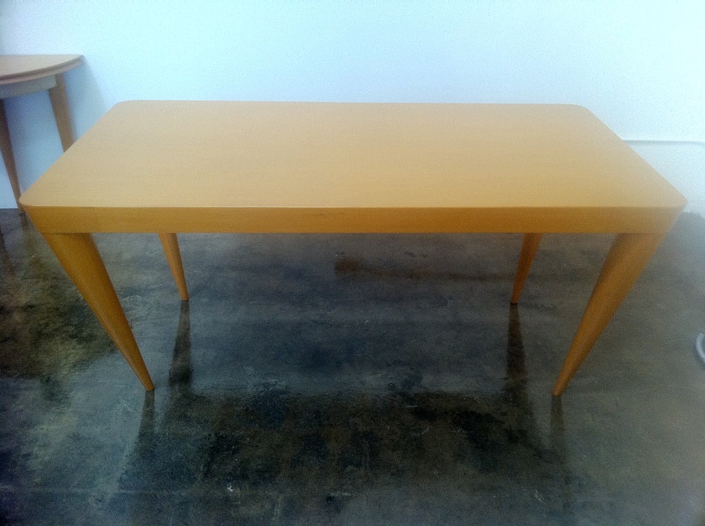 A Jean Royere table with exaggerated angled legs. Fully signed on underside.
Great as a library or dining table.