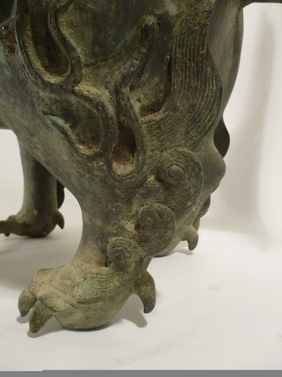 Chinese Bronze Lion Censer Temple Guardian.
Censer Guardians are mythological creatures originating from 7th Century to 8th Century AD, which were typically placed on temple entrances to ward off evil spirits. Usually two are placed on either side