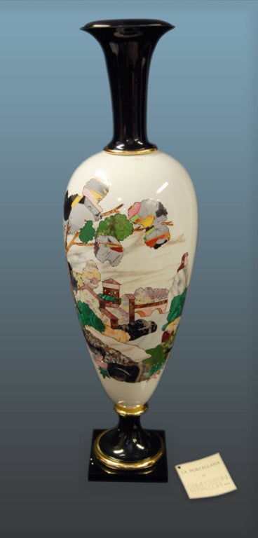 An art-deco style Italian vase hand painted with a palette of bold and bright contrasting polychrome and stylized images of trees, limbs, and a house against a white ground with overhead clouds. Although this vase is Italian, its design is in the