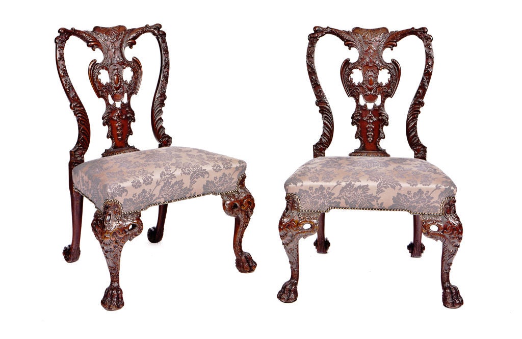 Set of four William IV heavily carved side chairs.