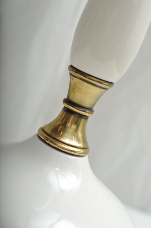 WHITE CERAMIC AND BRASS 1950S LAMP.  CURVEY GENIE STYLE LAMP.