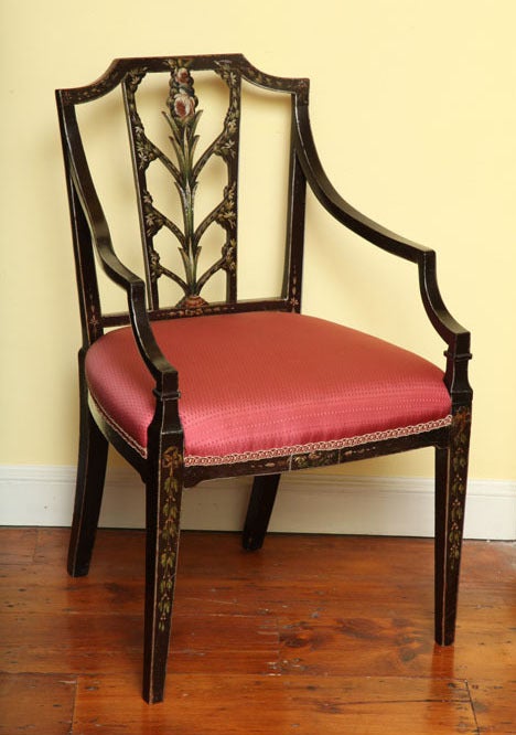 Fine antique Sheraton period armchair painted with flowers and ivory lines on a rich brown ground, having a pierced open splat and outcurvate arms with floral painted apron and front legs. English, circa 1795 Provenance: Hampton Court, Isle of Man.