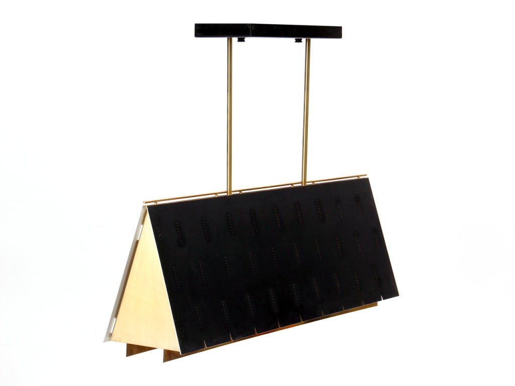 A brass and steel ceiling lamp with a notched black tent shade containing a motif of pinhole perforations. Retains the original brass diffuser. Drop is adjustable.