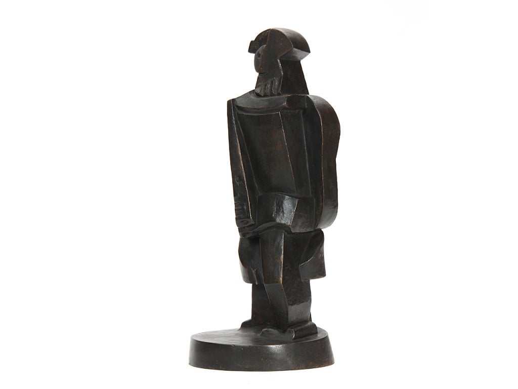 A finely modelled standing figural Cubist statue rendered in warmly patinated bronze, titled 