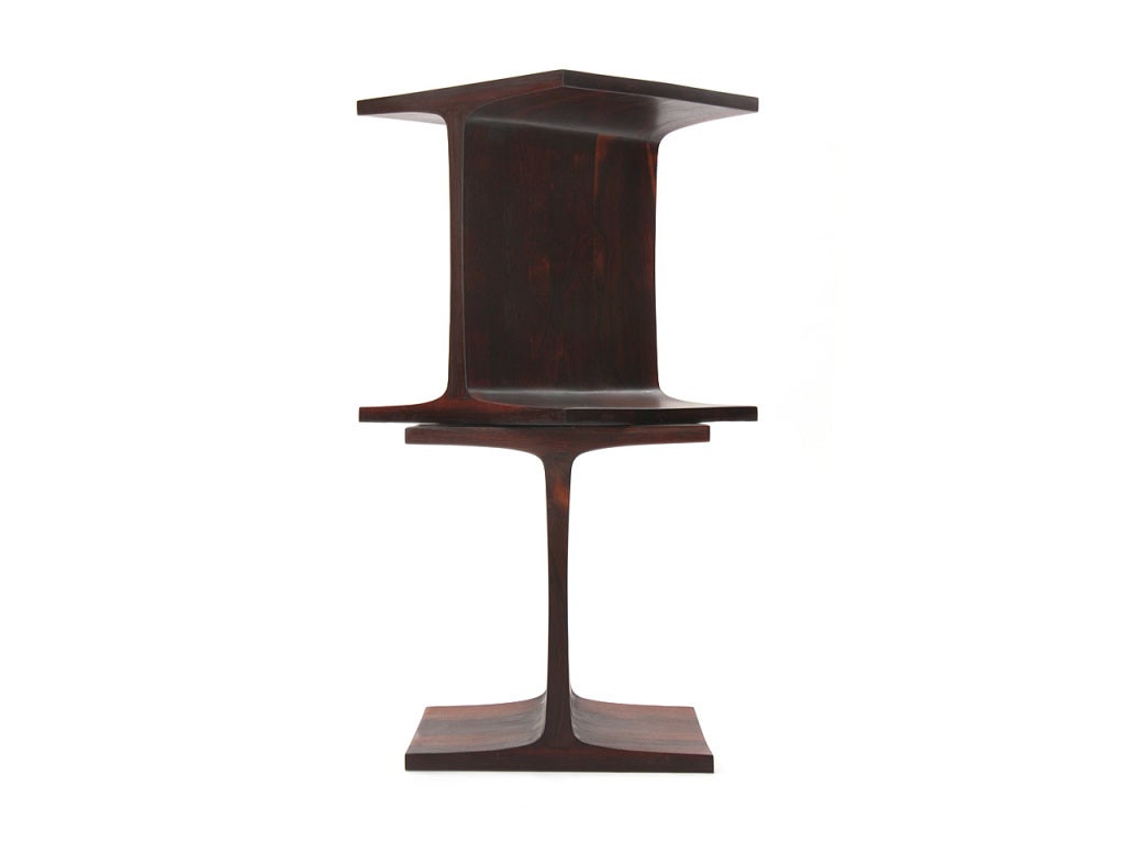A solid rosewood table in the form of an industrial i-beam.

Only 1 available.