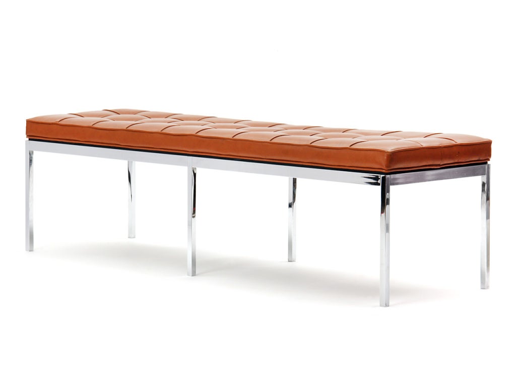 A bench with the original tan leather upholstery on a chromed steel base. By Knoll International. Multiples available.