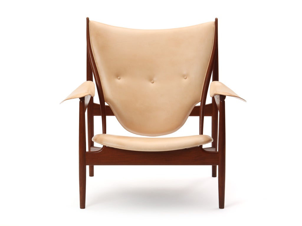 A fine and rare Chieftain armchair in teak designed by Finn Juhl, made by cabinetmaker Niels Vodder with natural untanned leather upholstery.