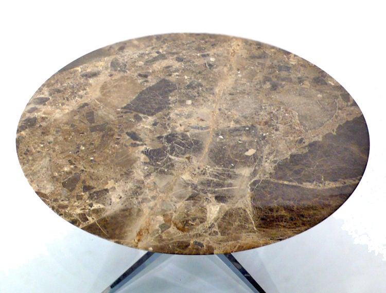 This round table has the most exquisite example of emperador marble that we have ever seen on a Florence Knoll designed dining table. This piece is all original and was manufactured by Knoll.