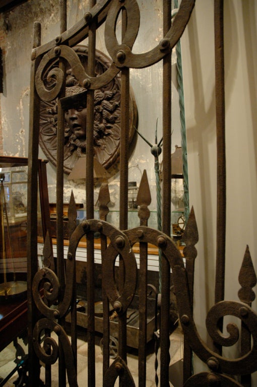 The most fabulous, rare and unique pair of gates we have ever owned. They are Italian 17th century hand-forged iron spearhead gates originally from the Palazzo Dona dalle Rose in Venice. Amazing for an interior or exterior application. A stunning
