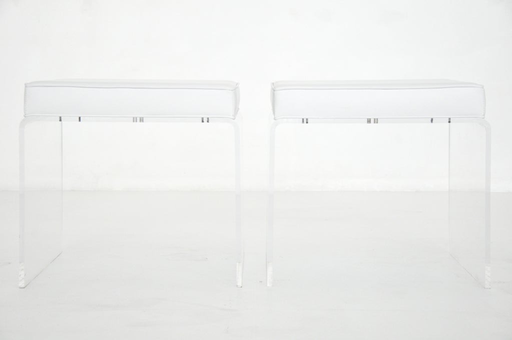 Pair lucite stools.  Lucite bases with newly upholstered white leather cushions.