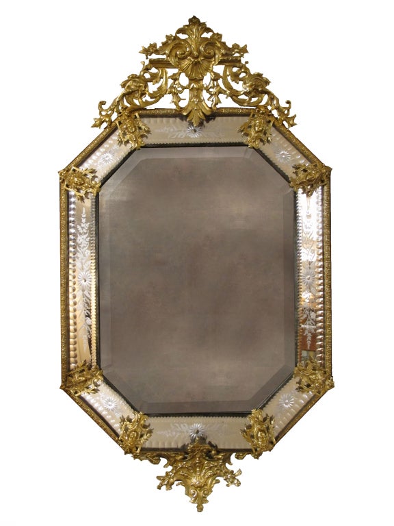 # X027 - Inspired by the Baroque designs of the late 17th Century, this Continental cast-metal and etched-glass mirror achieves the sumptuous glamour of the earlier prototypes with a play of light on the beautifully cast and chased gilt metal