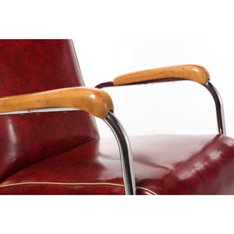 Art Deco or Mid-Century, 1940s-1950s red and black Naugahyde with off white piping trim. Continuous chrome arms and legs. Frame construction made of wood. Birch wood armrests. Very good original condition. 
Floor to arm 24