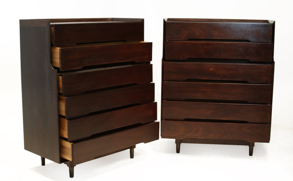 Pair of Walnut dressers each with 7 drawers with bottom pulls and tapered patinated brass legs. Drawers have a mint green painted bottoms. These dressers have elegant lines and are attributed to Edward Wormley's Drexel Prescedent collection. Price