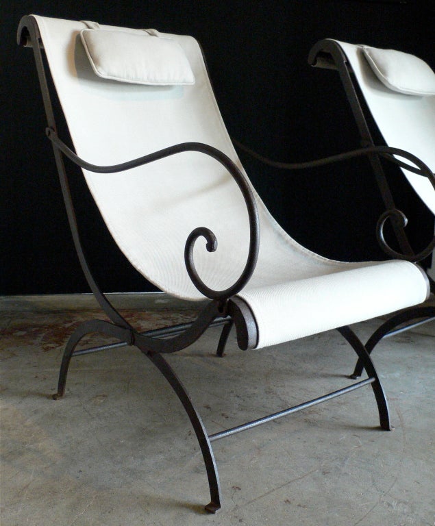 Beautiful pair of folding iron lounge chairs.
New slings/pillows in Sunbrella outdoor fabric.