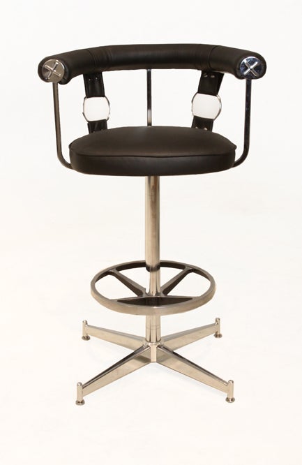 Set of 6 swiveling bar stools with chrome plated steel bases and accents. The chair seats and round backs have been upholstered in a black leather. Price is for the set.

Seat depth measures 16