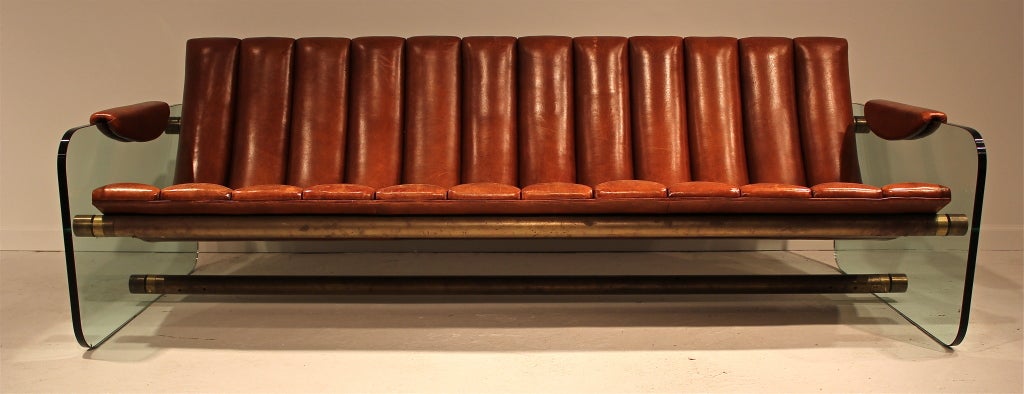 A stunning leather, brass, and glass sofa with all kinds of swagger and soul, attributed to Fabio Lenci.