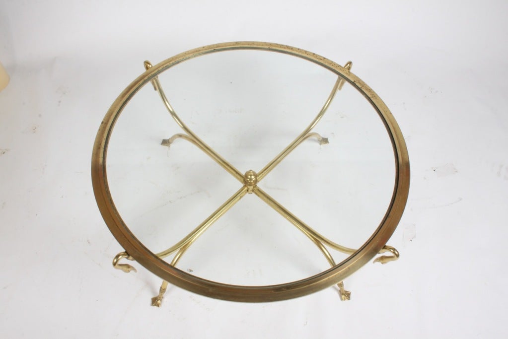 Stylized brass coffee or cocktail table with swan heads and webbed feet, marked made in Italy. In the style of Maison Bagues. Newer glass top . 
