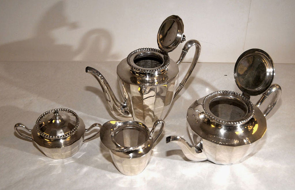 Mexican A STERLING SILVER TEA AND COFFEE SERVICE. MEXICAN, CIRCA 1950