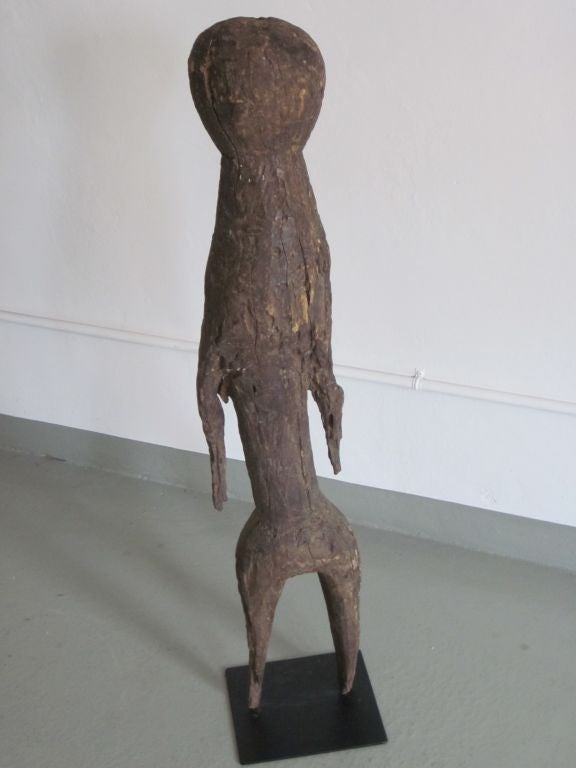 Elegant, carved wood sculpture representing the human figure from Togo, Africa. 
A large, dramatic piece for a tribal art collection and creating a rare, unique and special presence.