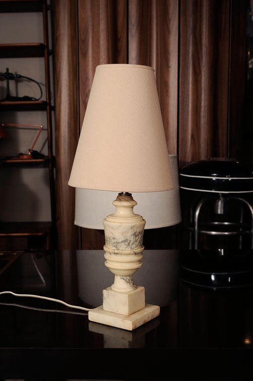 Pair of vintage alabaster boudoir table lamps.  French, circa 1940.

Features hand-carved ivory alabaster with a square base.  Professionally rewired with off-white silk cord.

Dimensions:
20.5 inch height with lamp shade (as shown)
13 inch