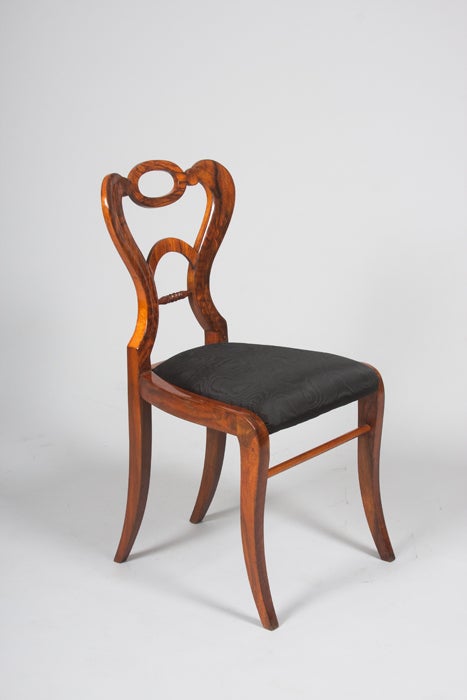 CH 20086.
A set of four Biedermeier side chairs.
Walnut veneer,
Vienna, circa 1830.
Measures: 36" H x 17.5" W x 17" D.