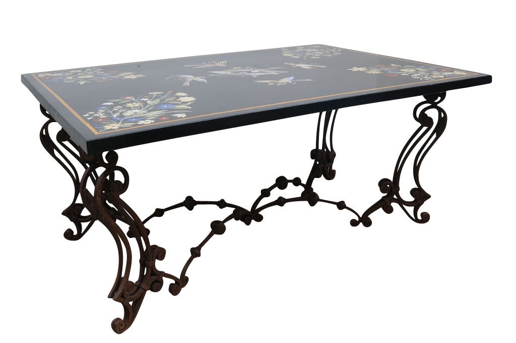 Italian Pietro Dura marble table inlaid with birds and foliate, raised on two trestle supports from with monopodia sides headed with kams head and ending in scrolled feet, original restored condition.