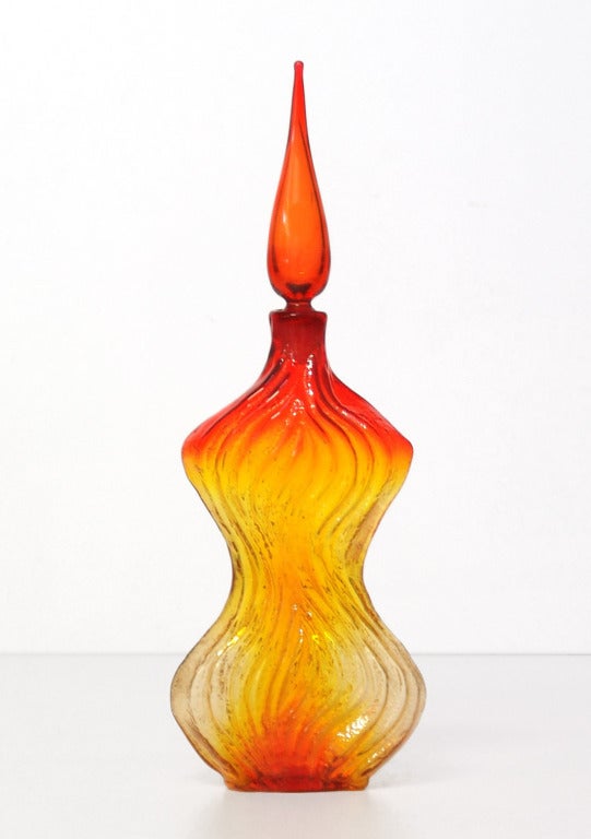 _____
(Items shown in groupings are also available individually, please email to inquire.)

Trio of deeply textured Tangerine colored ('amberina' variant) decanters designed by Wayne Husted for the Blenko Glass Company.

LEFT: curvaceous flat